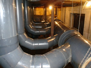 Exhaust duct header system in PVC construction.