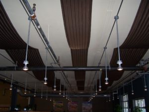 Tröegs brewery tasting room outfitted with decorative acoustic panels for noise reduction.